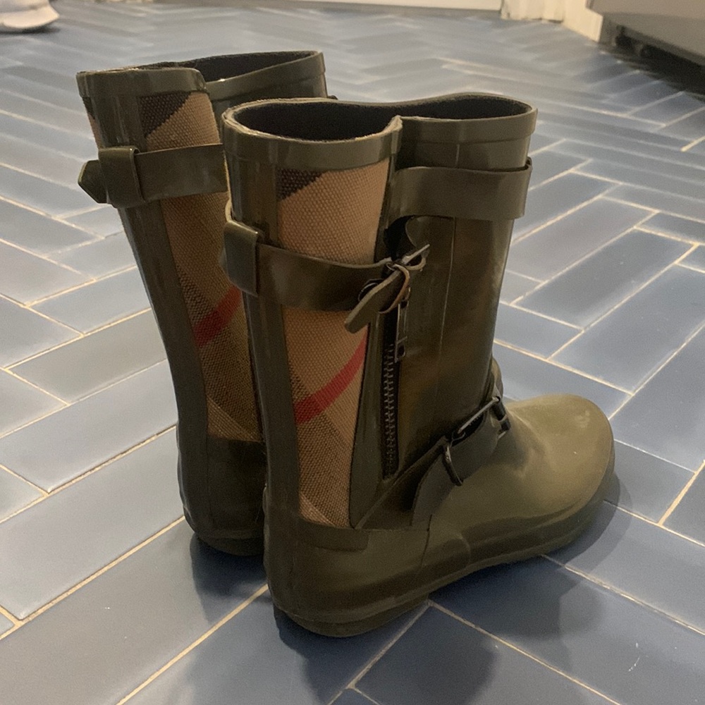 Olive green Burberry rain boots.